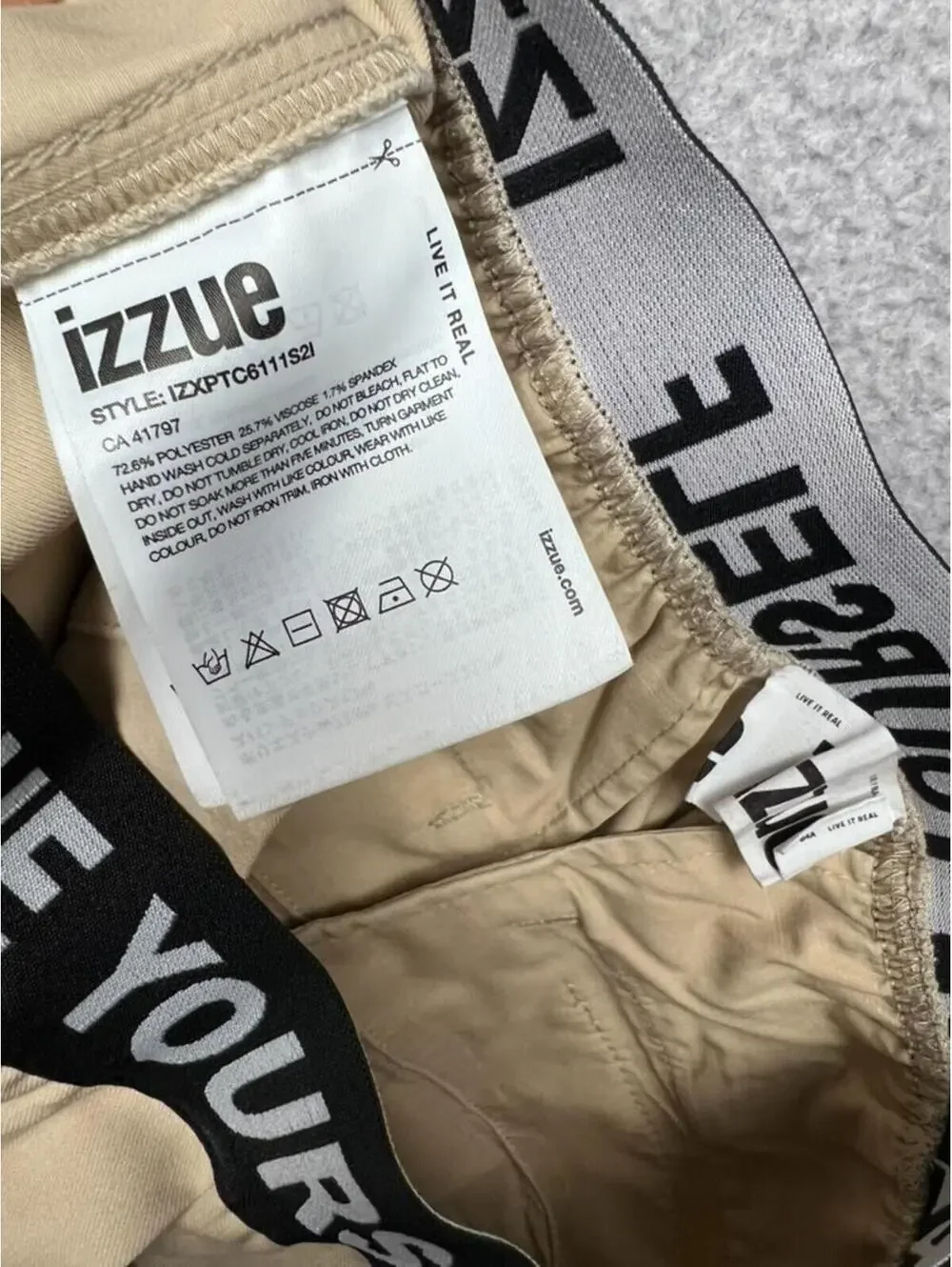 IZZUE Yourself Khaki Pleated Trousers Logo Waistband Tapered Pants Womens 29 In